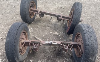 Osi do przyczepy+8 felg 10 szpilek HL, przednią oś do stara.